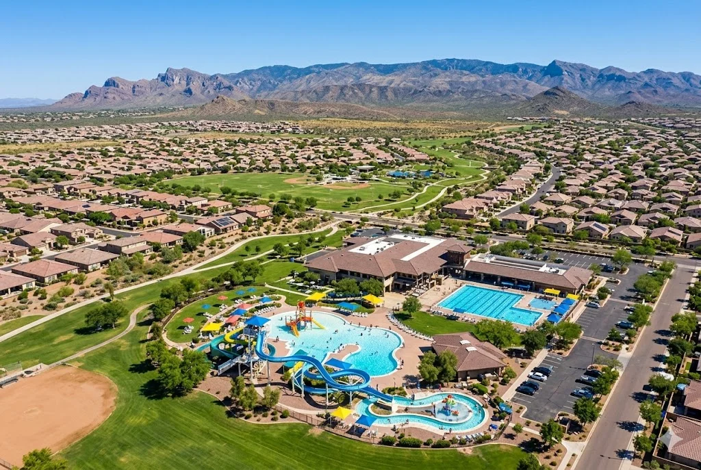 Aerial view of Anthem Arizona community center and water park with master-planned neighborhoods and desert mountain backdrop